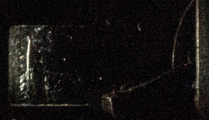 Figure 23. A faint light leak is detected in the film-gate area of the Bell & Howell 414PD while the shutter is closed. Filmed in total darkness. (Source: Photo by author)