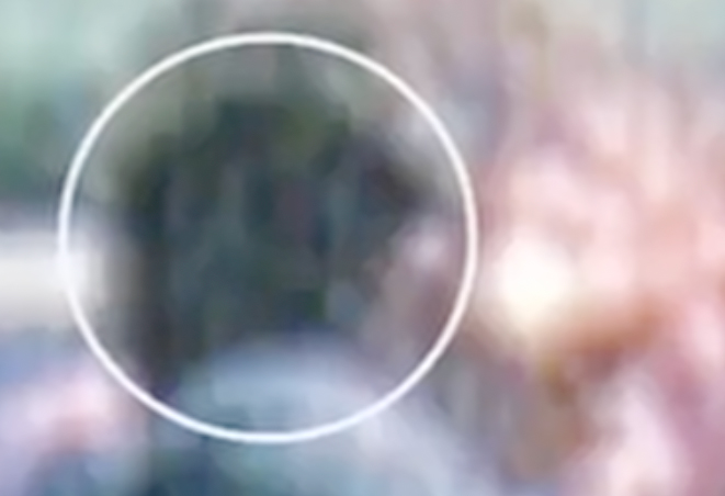 Figure 37. Further lightening helps visualize the apparent interior of the head wound; the area with a slight reddish hue is more visible. (Source: Same as Figure 36; further lightening by author)