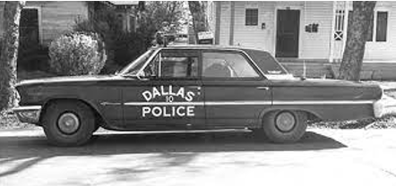 A Dallas Police Car Parked Outside a Home