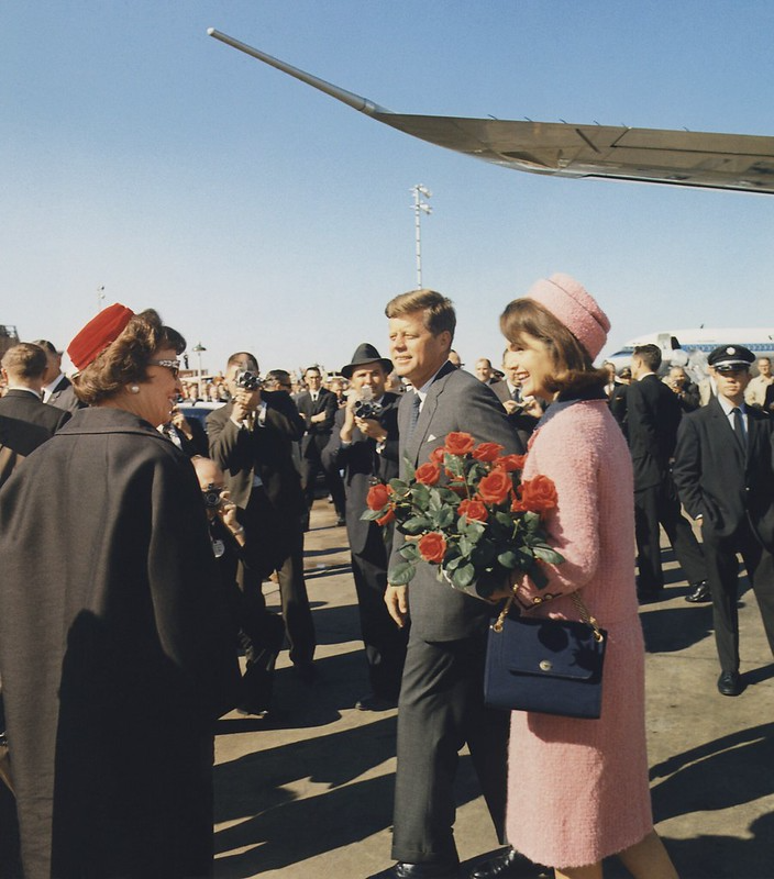 President John F. Kennedy with the First Lady Being Welcomed by Reporters and Local Politicians on the Day of His Assassination