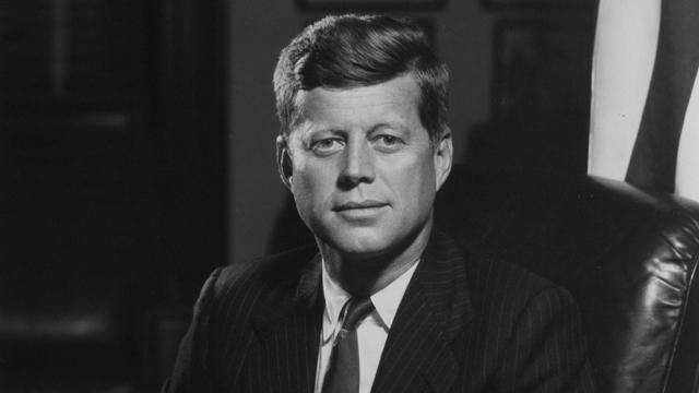 A Portrait of John F. Kennedy Sitting on a Leather Sofa